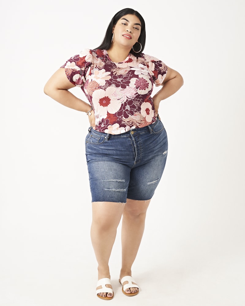 Plus size model with hourglass body shape wearing Joan Frayed-Hem Denim Bermuda Shorts by East Adeline | Dia&Co | dia_product_style_image_id:161074